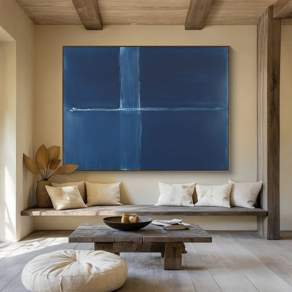 A large abstract painting featuring a deep blue background with a thin straight line and a thick wavy line in the center.SC515