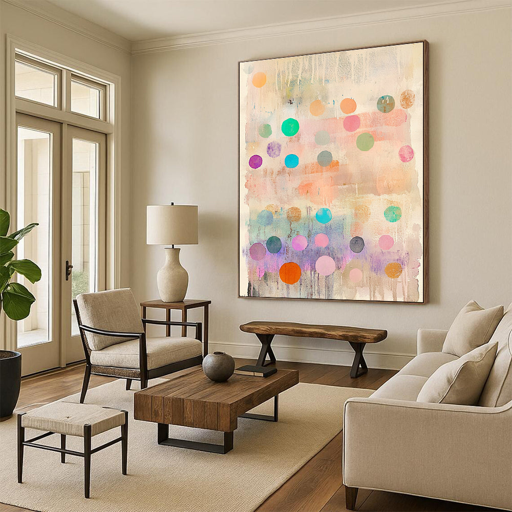 Large abstract painting featuring delicate pastel colors with whimsical round shapes and vibrant polka dot stripes creating an organic depth and dreamy quality.STSC1043