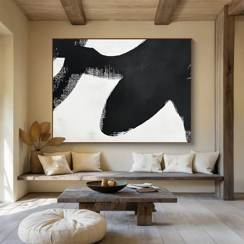 Large abstract painting in black and white featuring simple shapes and broad brush strokes inspired by an orca's tail flippers.SC016