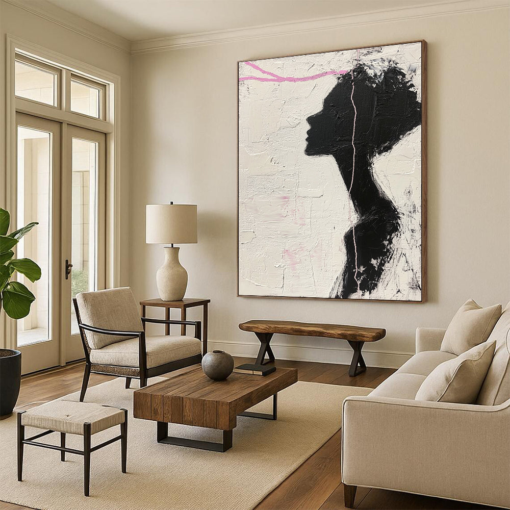 Large abstract painting in black and white featuring a woman’s silhouette with pink accents enhancing her facial features against a textured background.STSC1091