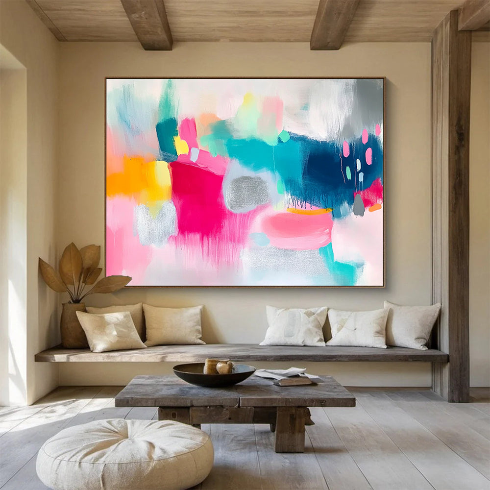 Large abstract painting featuring vibrant pink and teal shapes on a white background with bold brush strokes and shimmering silver foil accents.SC215