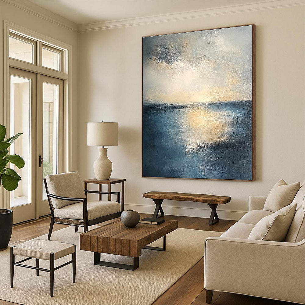 Abstract seascape in muted blue and grey tones with warm yellow sunlight evoking tranquility and reflection on canvas using soft oil paint gradients.STSC461