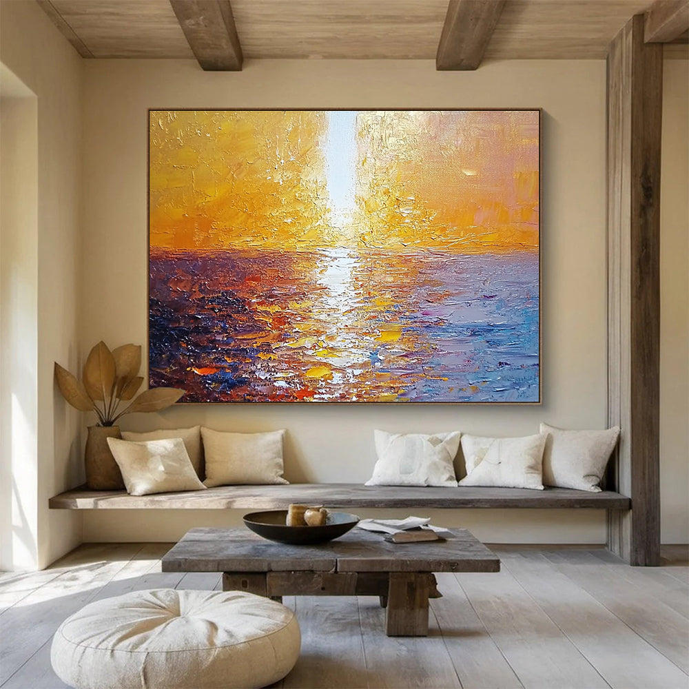 Large abstract painting of a golden sunset over the sea with a white beam illuminating the water surface from the top-left corner.SC111