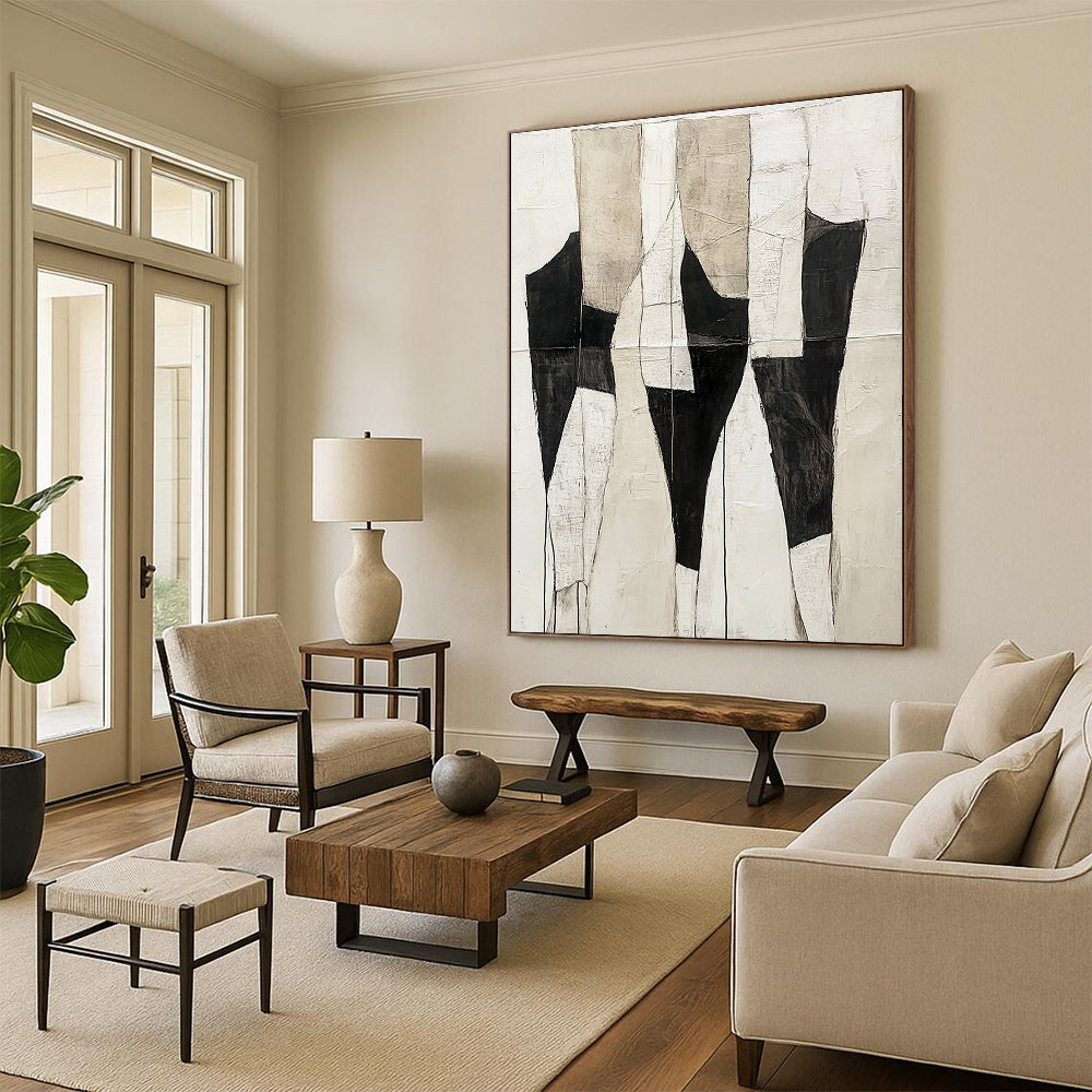 Large abstract painting featuring a light white and black color scheme with ivory cream background and textured body shapes in dark gray and white.STSC403