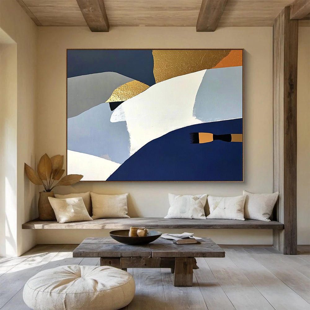 Large abstract painting featuring white blue and gold shapes against a dark gray backdrop with orange details and a soft yellow surface.SC444