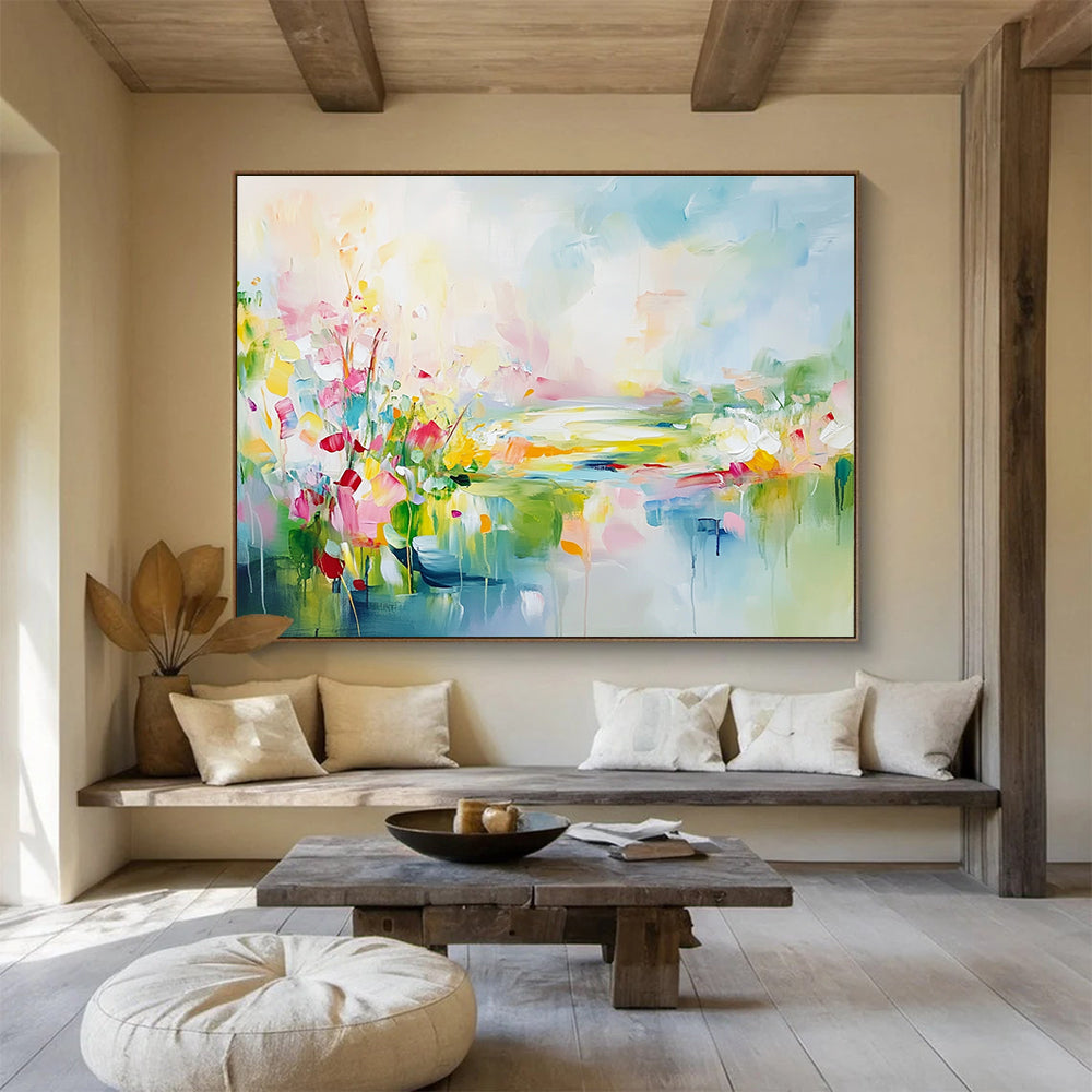 Large abstract landscape painting featuring spring flowers in a colorful meadow with a flowing river vibrant greenery and a serene sky.SC084