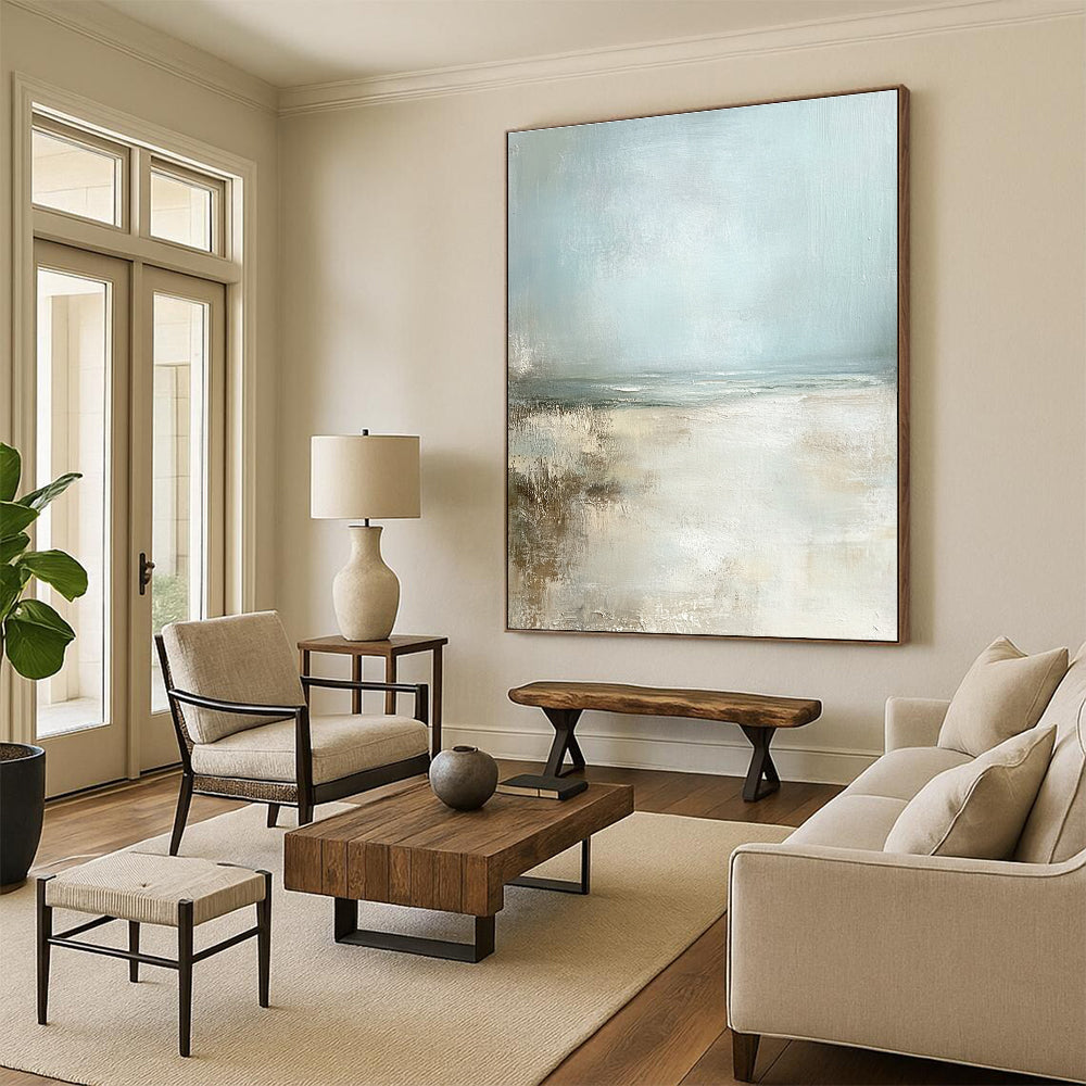 Large abstract painting featuring a serene pale blue sky and sandy beach in neutral colors for a calming ambiance.STSC095