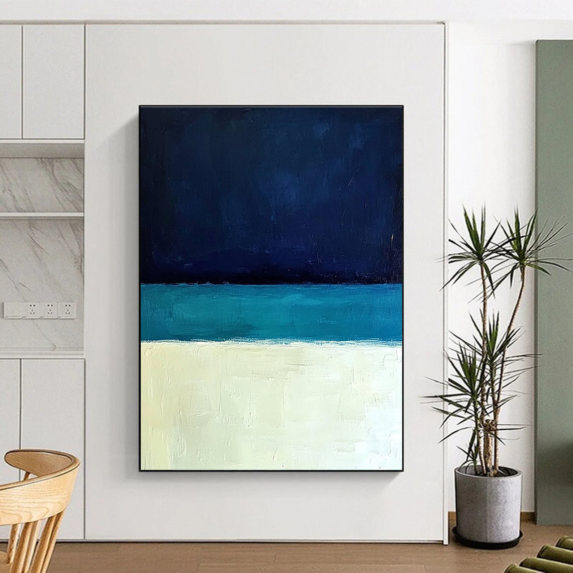 Large abstract painting featuring a minimalist ocean scene with blue tones white sand beach and a dark sky in Rothko style.STSC884