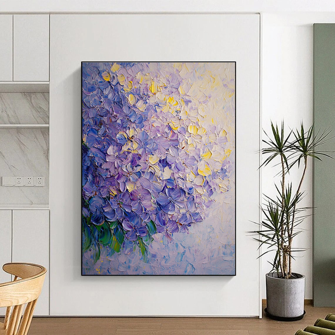 A large abstract oil painting of lilac flowers featuring soft shadows and smooth textures in light yellow and purple tones.STSC1027