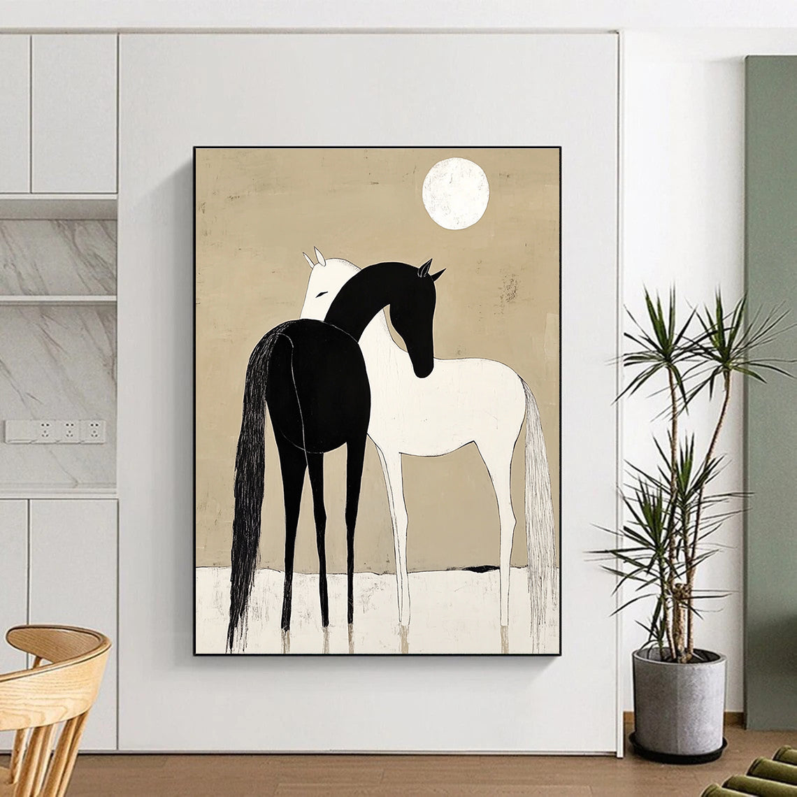 A large abstract painting depicting a black horse and white pony cuddling under a moonlit sky with simple shapes and a minimalistic beige background.STSC915