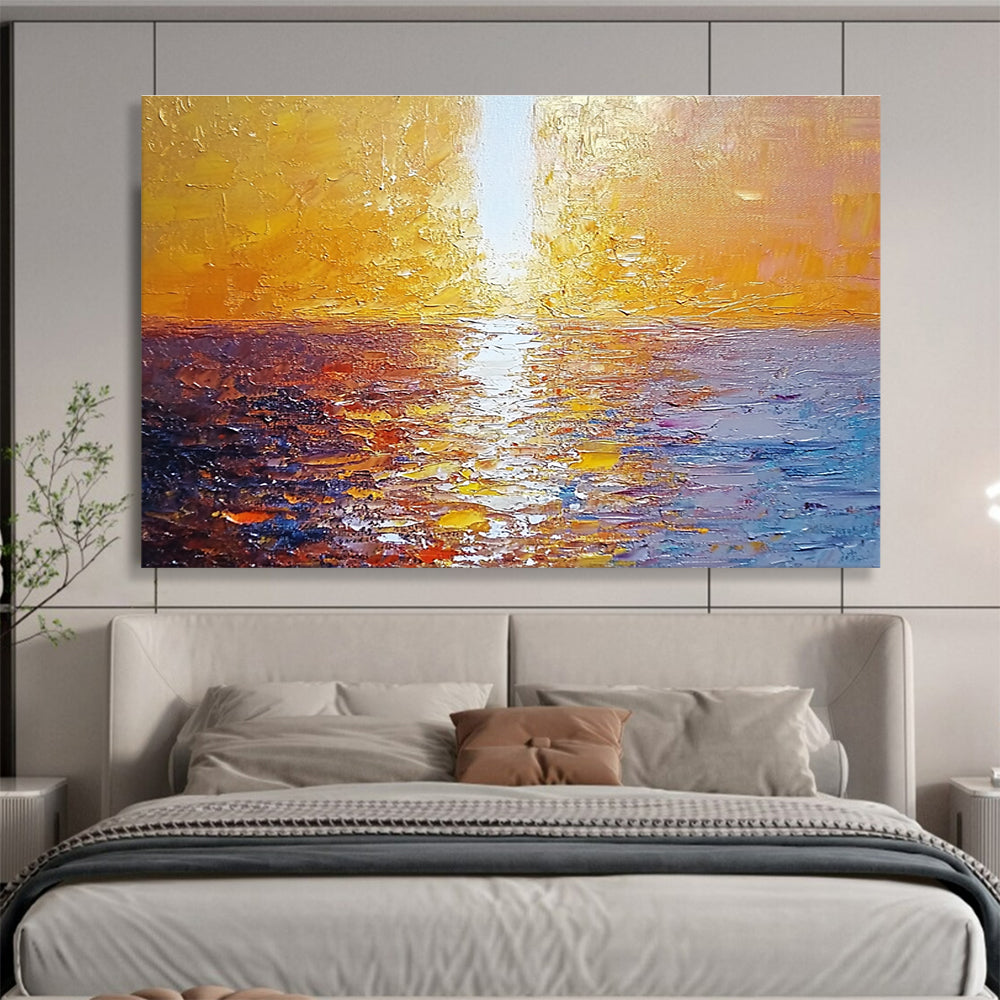 Large abstract painting of a golden sunset over the sea with a white beam illuminating the water surface from the top-left corner.SC111