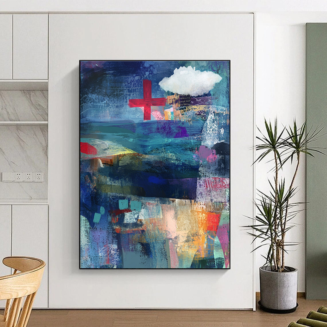 Abstract mixed media collage of the sea in blue and purple with a red cross and white cloud layered with fabric ribbons and watercolor splashes.STSC575