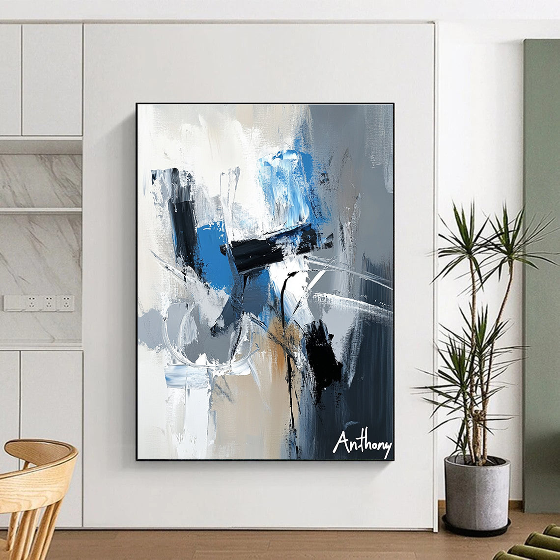 Large abstract painting featuring the name Anthony in white gray and blue tones with dynamic brush strokes and rich textures.STSC450