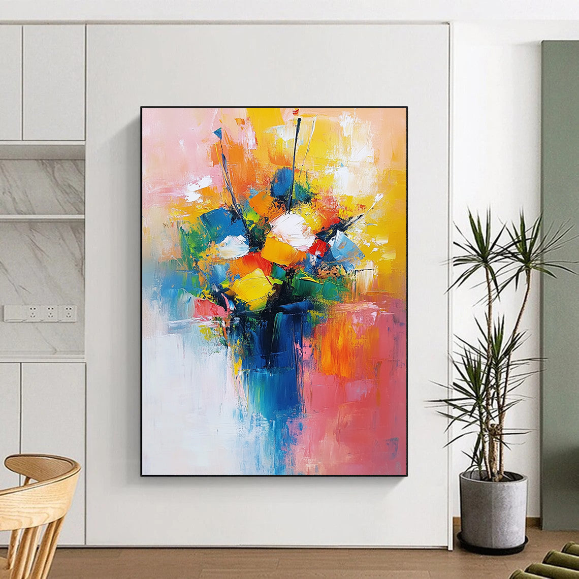 Large abstract painting featuring a vibrant bouquet in yellow blue and red with a light pink orange background conveying joy and calmness.STSC251