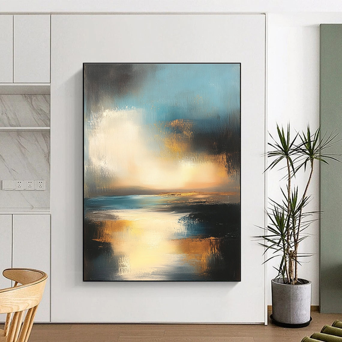 Large abstract oil painting depicting the ocean and sky at sunset with muted colors and gold accents for a serene ambiance.STSC196