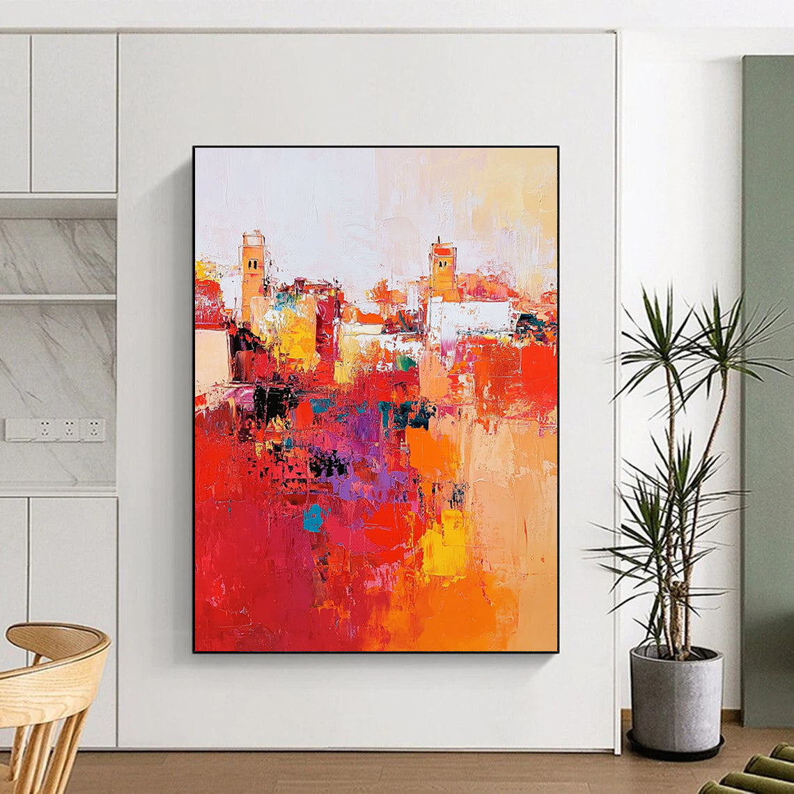 Large abstract painting depicting Marrakech cityscape with vibrant reds and oranges thick brush strokes and dynamic composition creating atmospheric lighting.STSC556