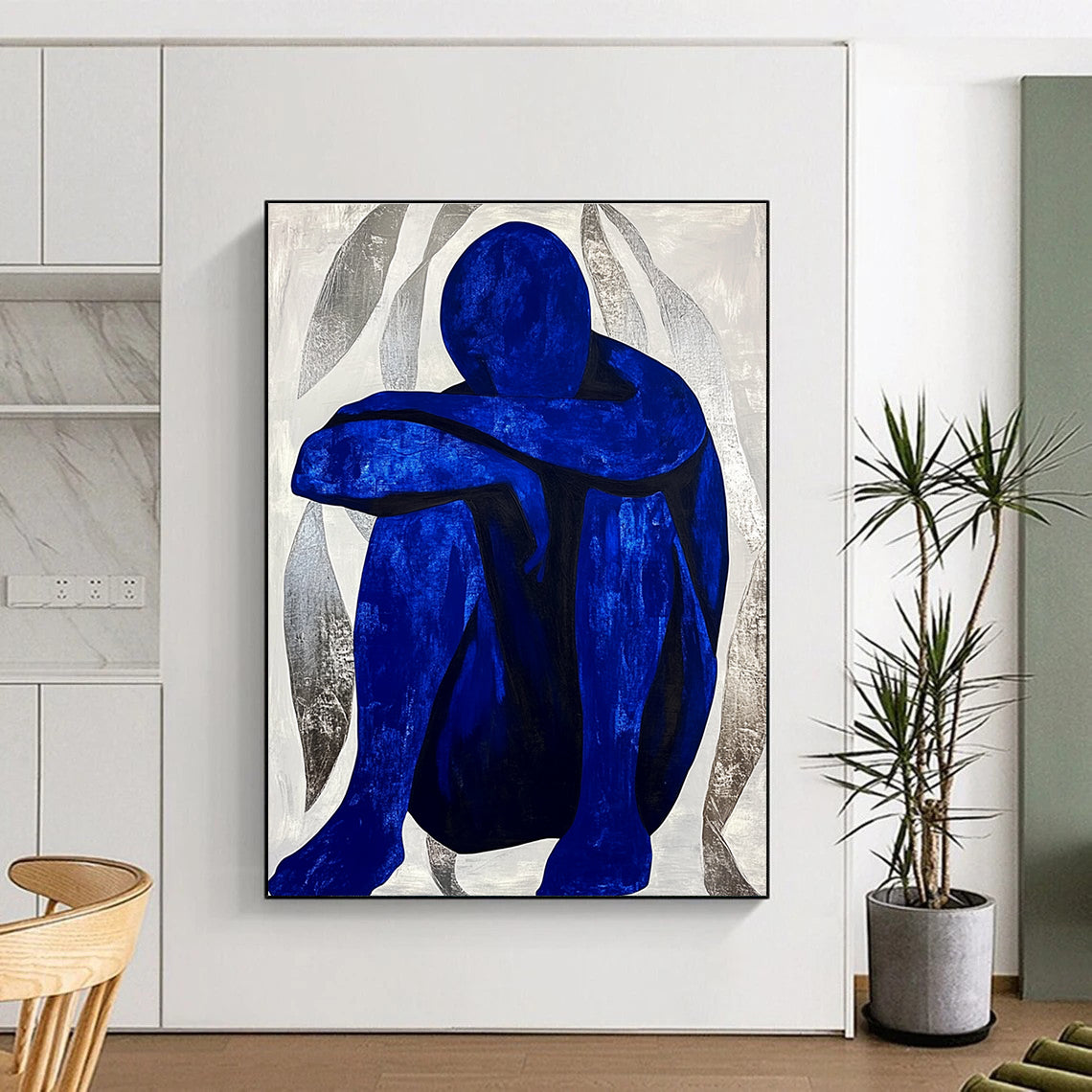 Large abstract painting featuring a contemplative blue figure amidst silver swirls, evoking tranquility and focus in a minimalist style.STSC922