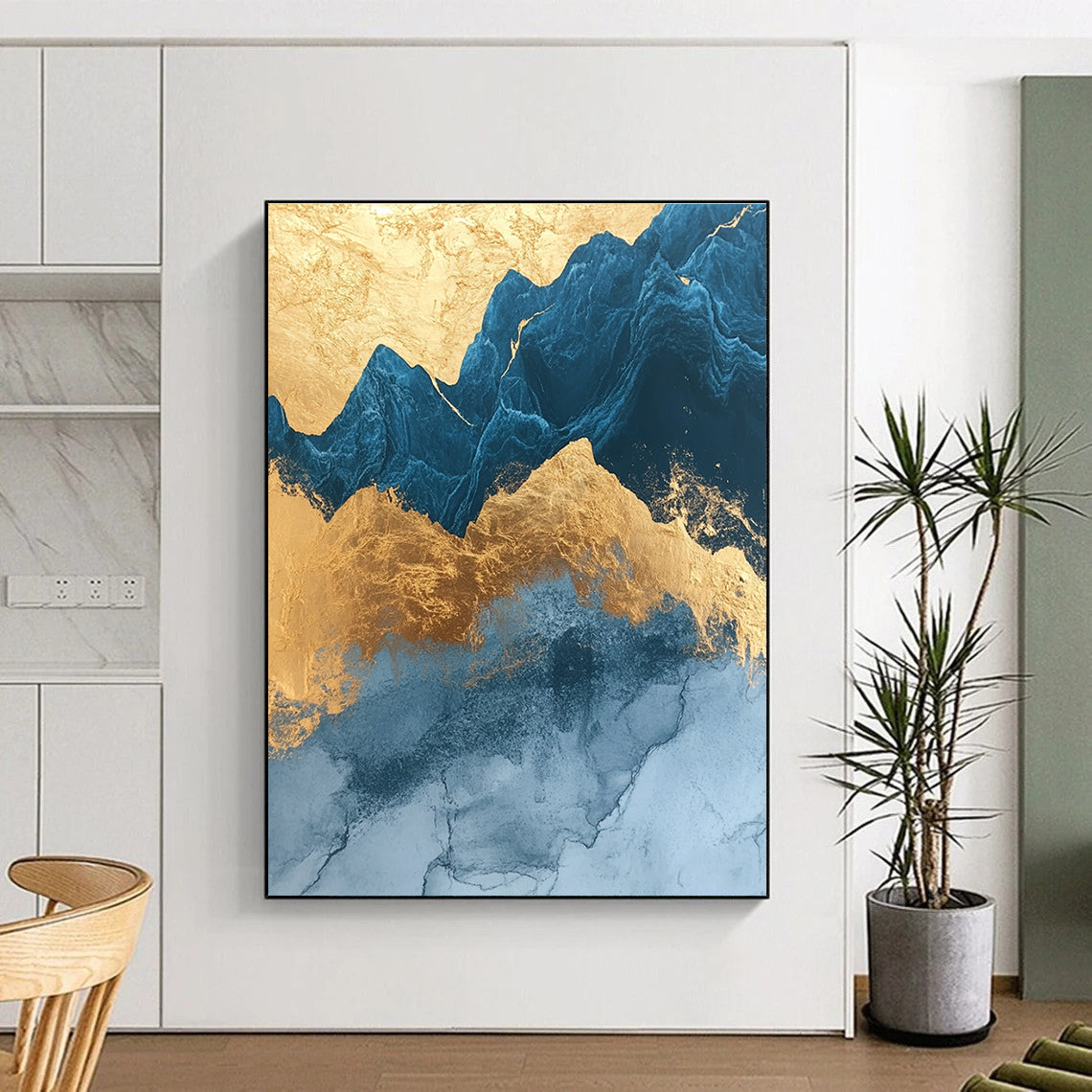 Abstract painting with marble texture rounded edges in gold foil and dark blue glass outlines featuring mountains and simple decorative lines.STSC1312