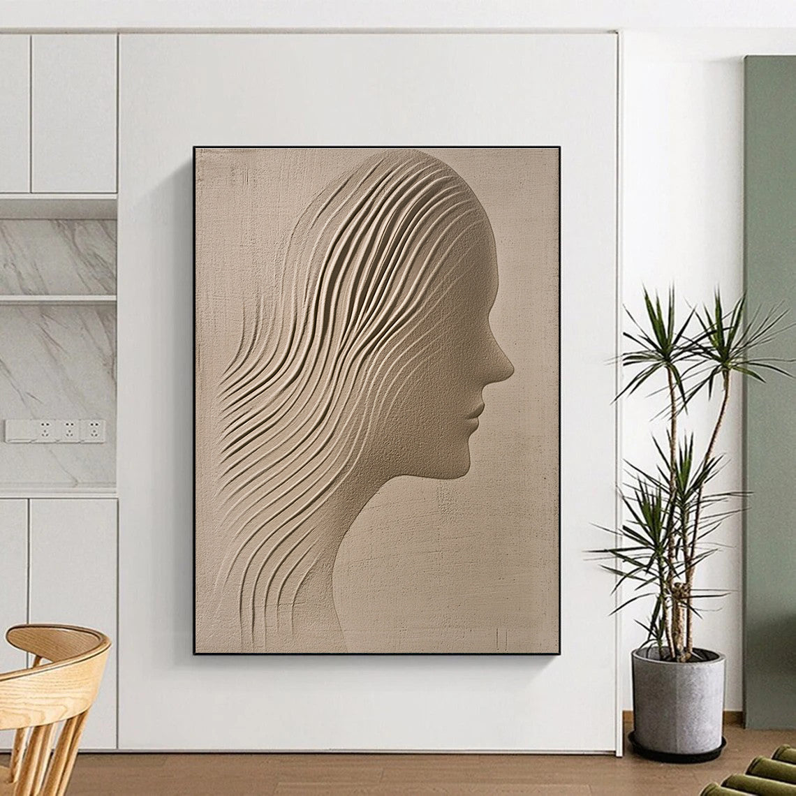 A large abstract painting featuring a sand-colored textured wall with an ethereal woman's silhouette gracefully carved into it.STSC1213