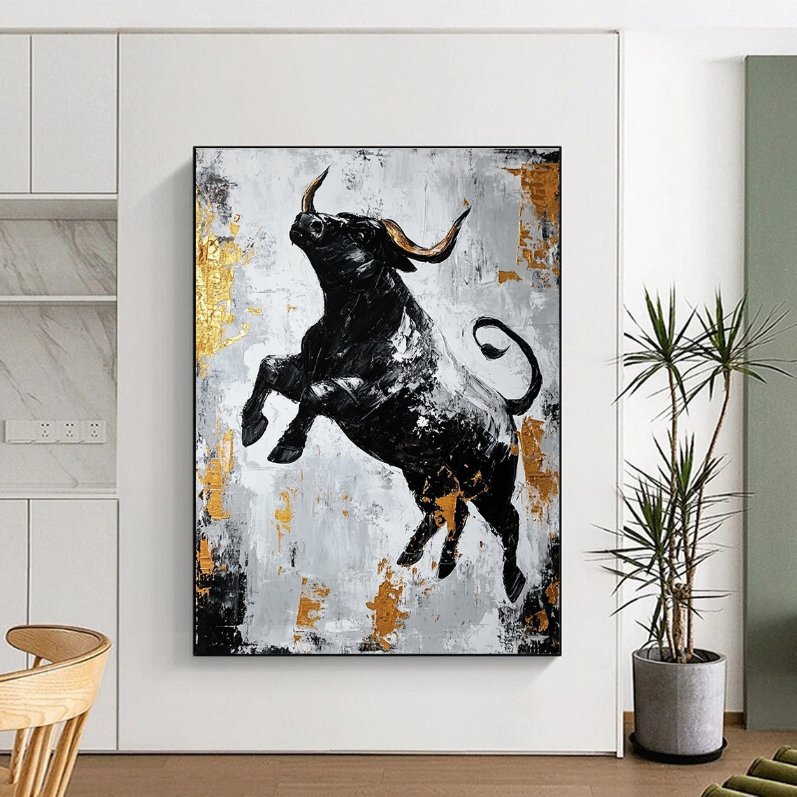 Large abstract painting featuring a dynamic black bull in gold and gray with strong contrasts and rough brushstrokes conveying powerful strength.STSC913