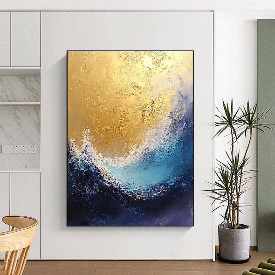 Large abstract painting depicting stormy seas in gold and blue tones with a textured finish perfect for enhancing any space.STSC334