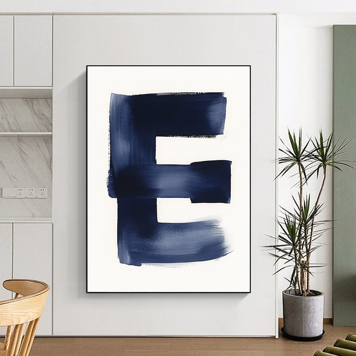 A large abstract painting featuring a minimalist watercolor letter E in navy blue against a white background emphasizing negative space and soft tones.STSC1096