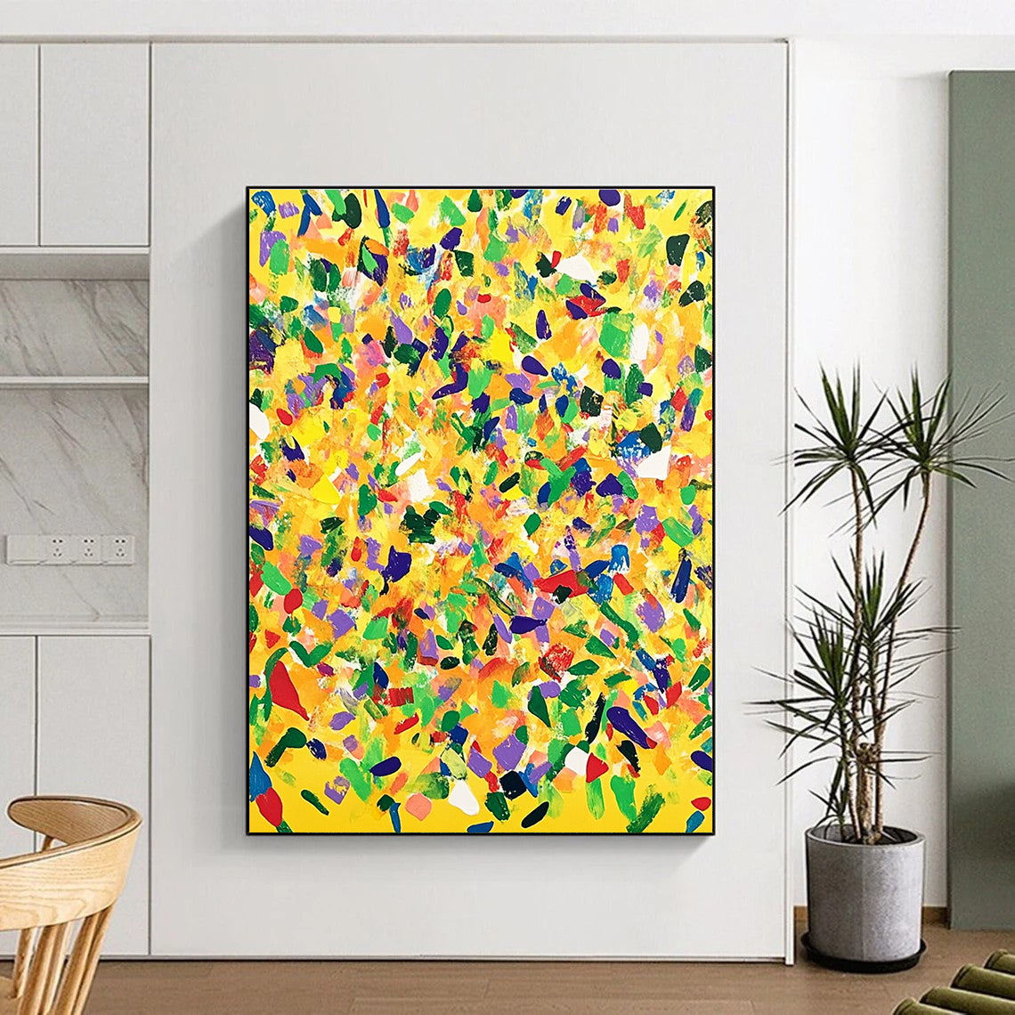 Large abstract painting with a yellow background and colorful confetti in joyful patterns, oil on canvas from the My Caverns series.STSC1269