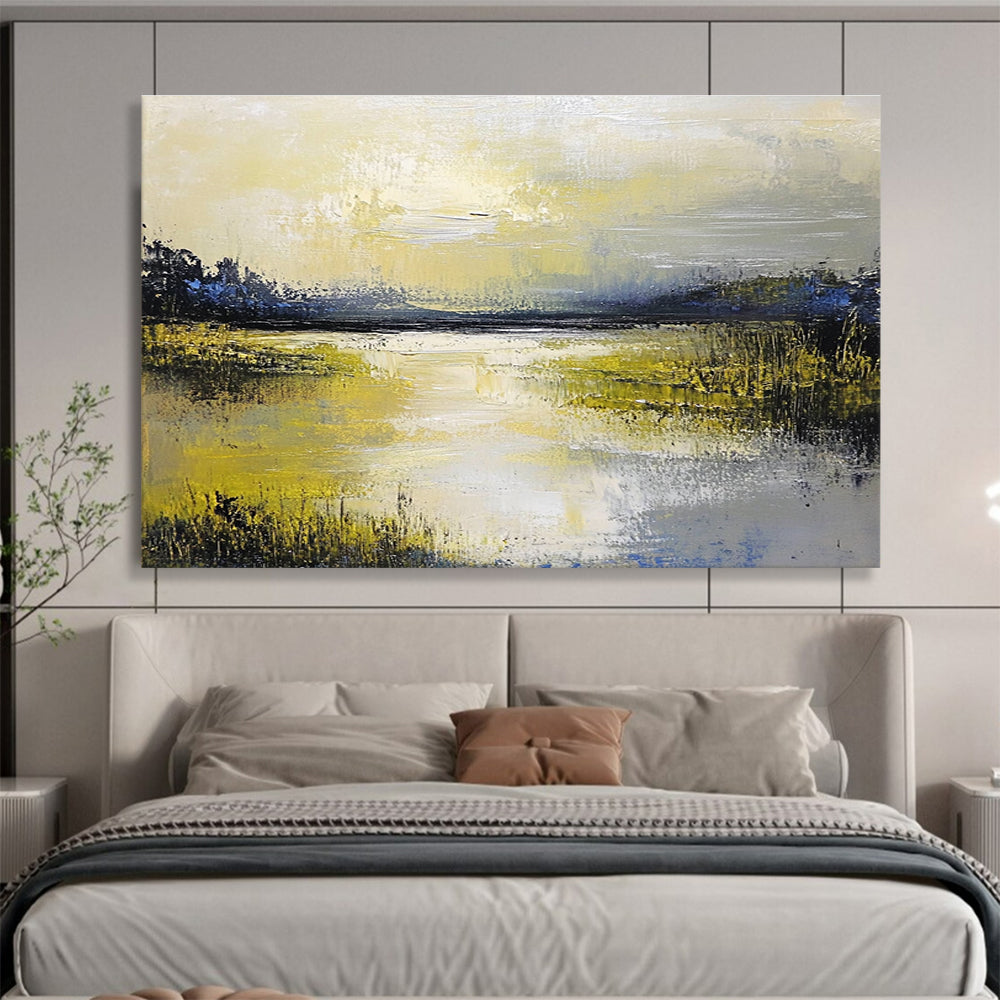 Large abstract painting featuring a serene lake and sky in soft yellow green blue and gray tones with thick textured paint.SC078