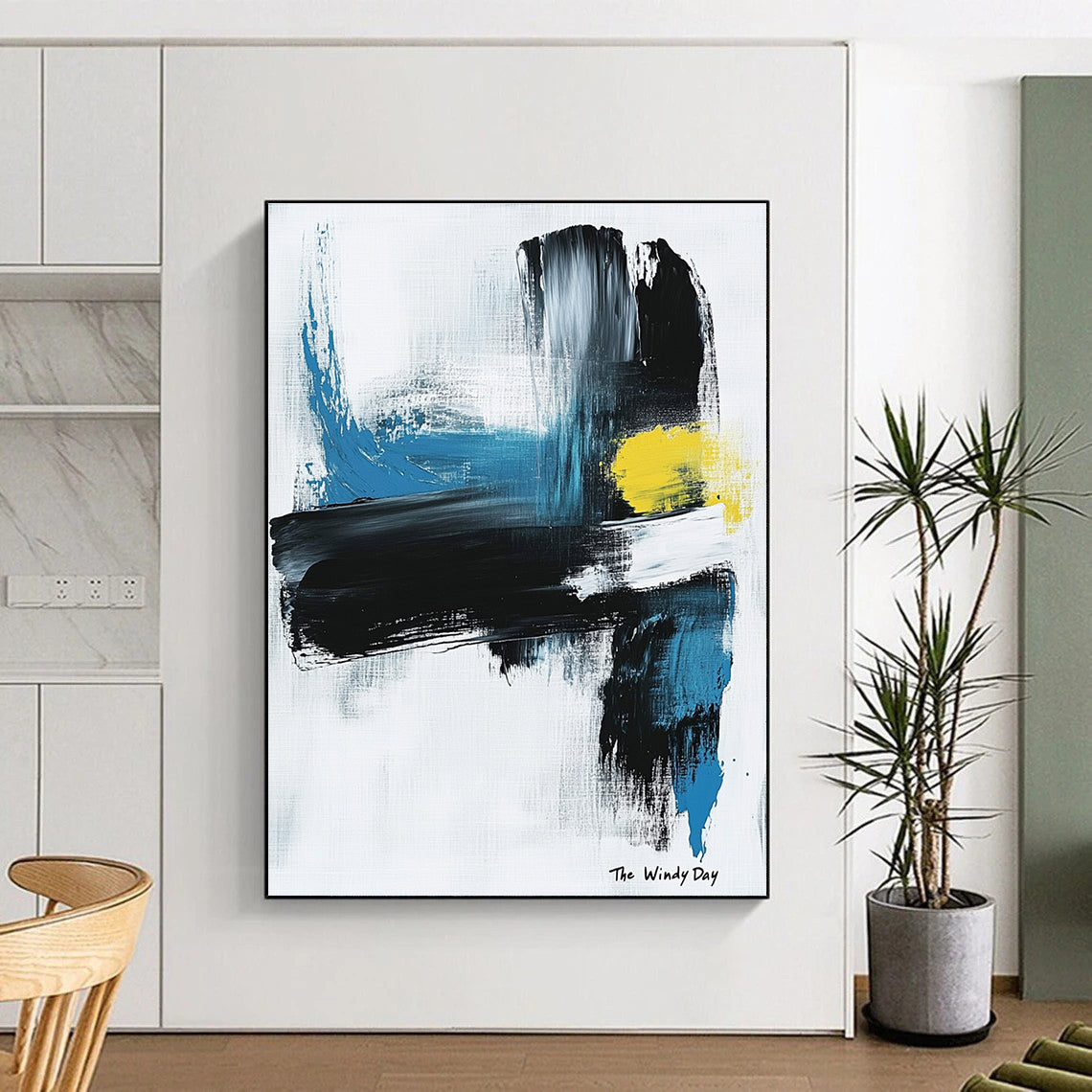 Large abstract painting in black and white with blue or yellow accents on light gray background featuring text The Windy Day.STSC1070