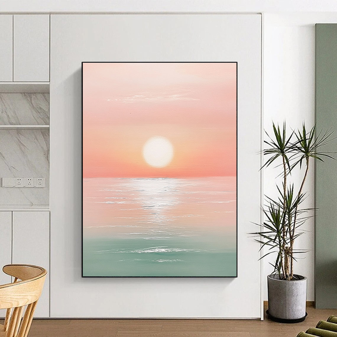 A large abstract painting featuring a sunset over the ocean in pastel pink and mint green with a white sun at the center.STSC1425