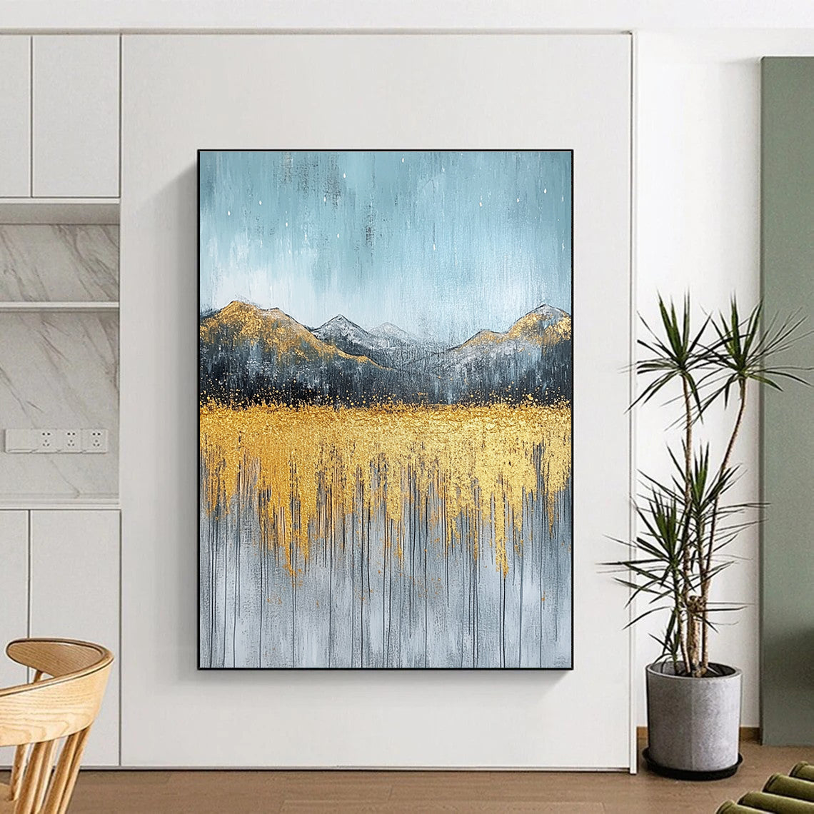 Large abstract painting with gold and silver on textured canvas featuring a serene sky golden mountains and soft gray grass.STSC097
