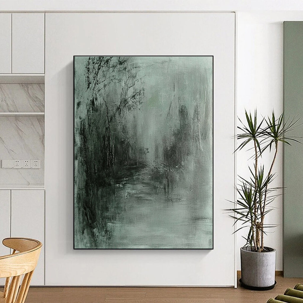 Large abstract painting in gray and green tones featuring soft edges and a dark background evokes tranquility and mystery through fluid brushstrokes.STSC419