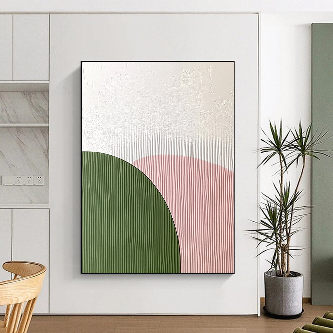 Abstract art featuring an arch-shaped wall decoration with a smooth white top and green textured paper bottom in soft pink pastel colors.STSC935