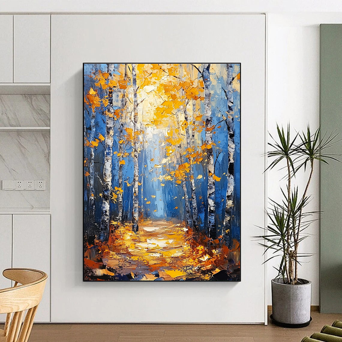 Large abstract painting of birch trees in autumn featuring blue and gold tones with textured background and tranquil atmosphere of sunlight filtering through branches.STSC870