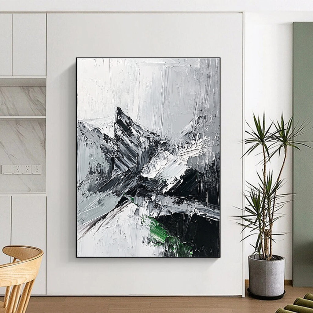 Large abstract painting featuring impasto technique with thick black and white strokes depicting a misty mountain range and a small patch of snow.STSC427