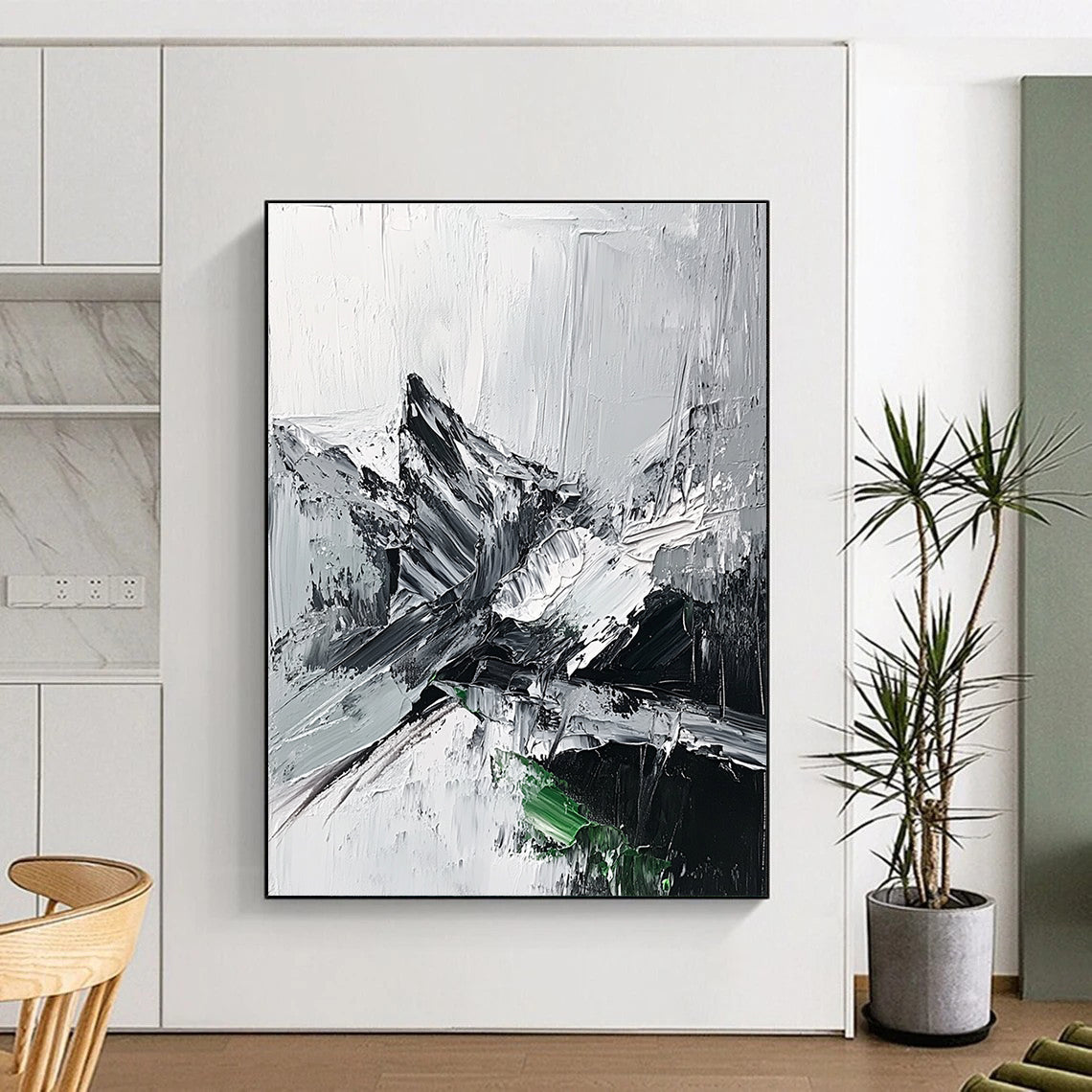 Large abstract painting featuring impasto technique with thick black and white strokes depicting a misty mountain range and a small patch of snow.STSC427