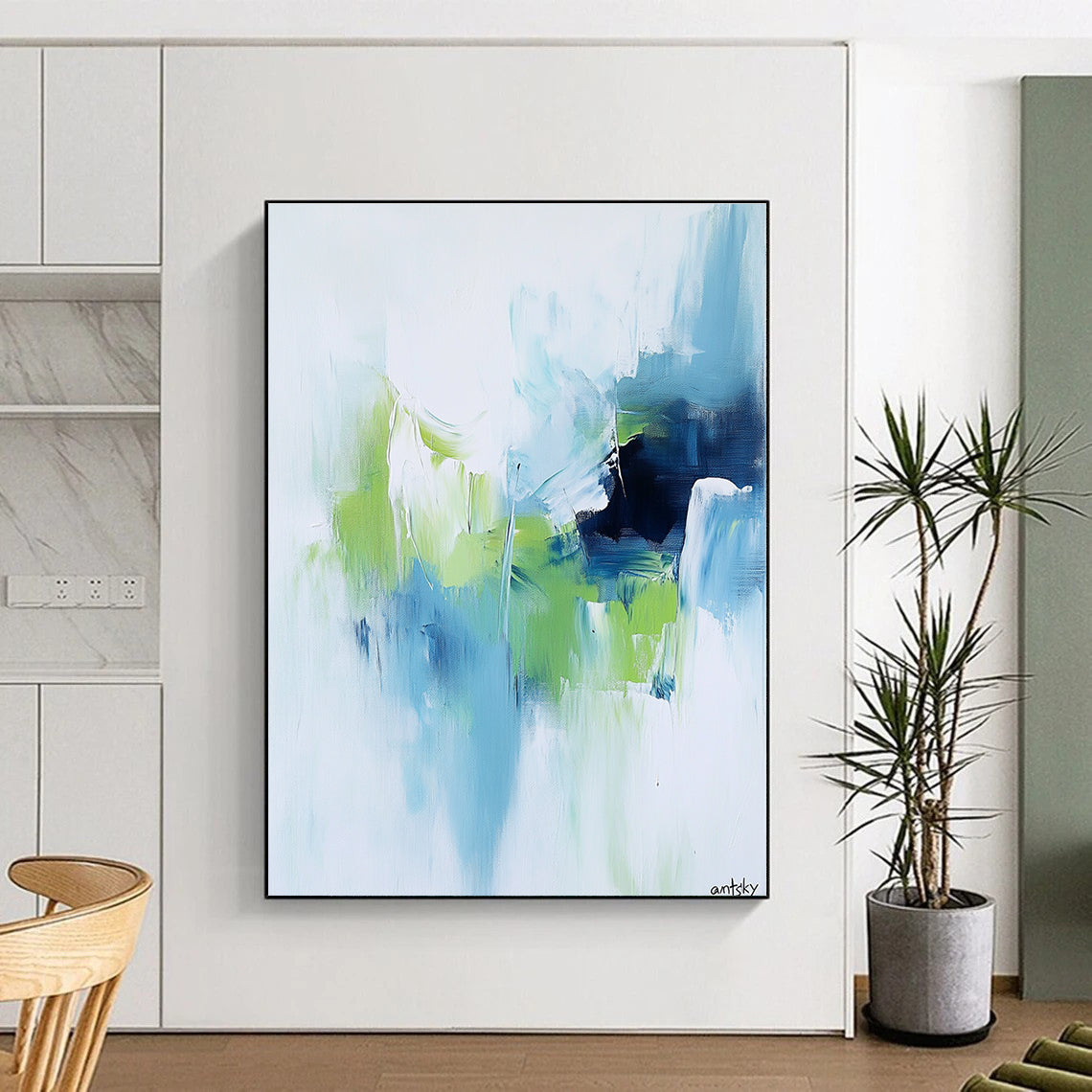 Large abstract painting featuring white blue and green tones with antsky in the lower right corner.STSC826