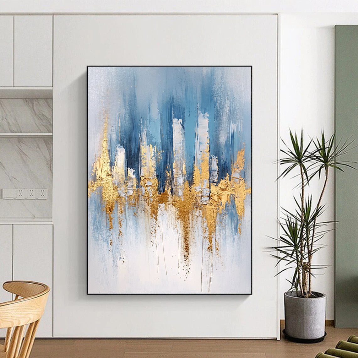 Large abstract blue and gold painting with urban landscape details light gray brushstrokes and elegant gold foil accents on canvas edges.STSC033