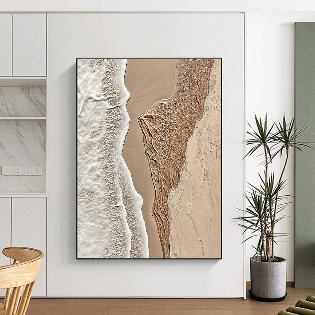 A large abstract painting featuring intricate textures of beige sand and white waves capturing the tranquility of coastal landscapes.STSC1294