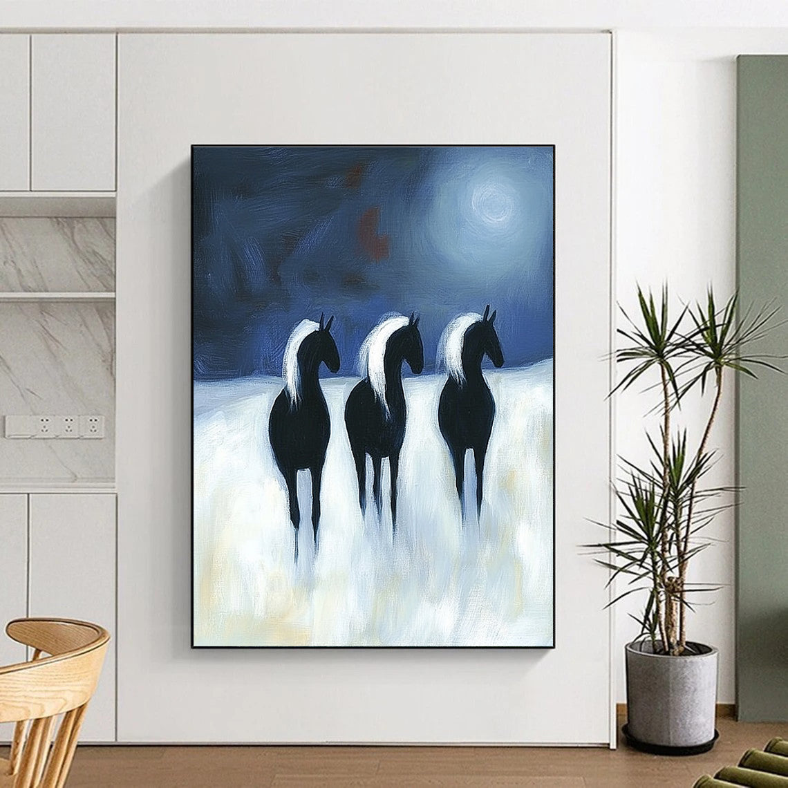 Abstract painting featuring three black horses with white manes running under moonlight on a white background in a flat two-dimensional style.STSC1443
