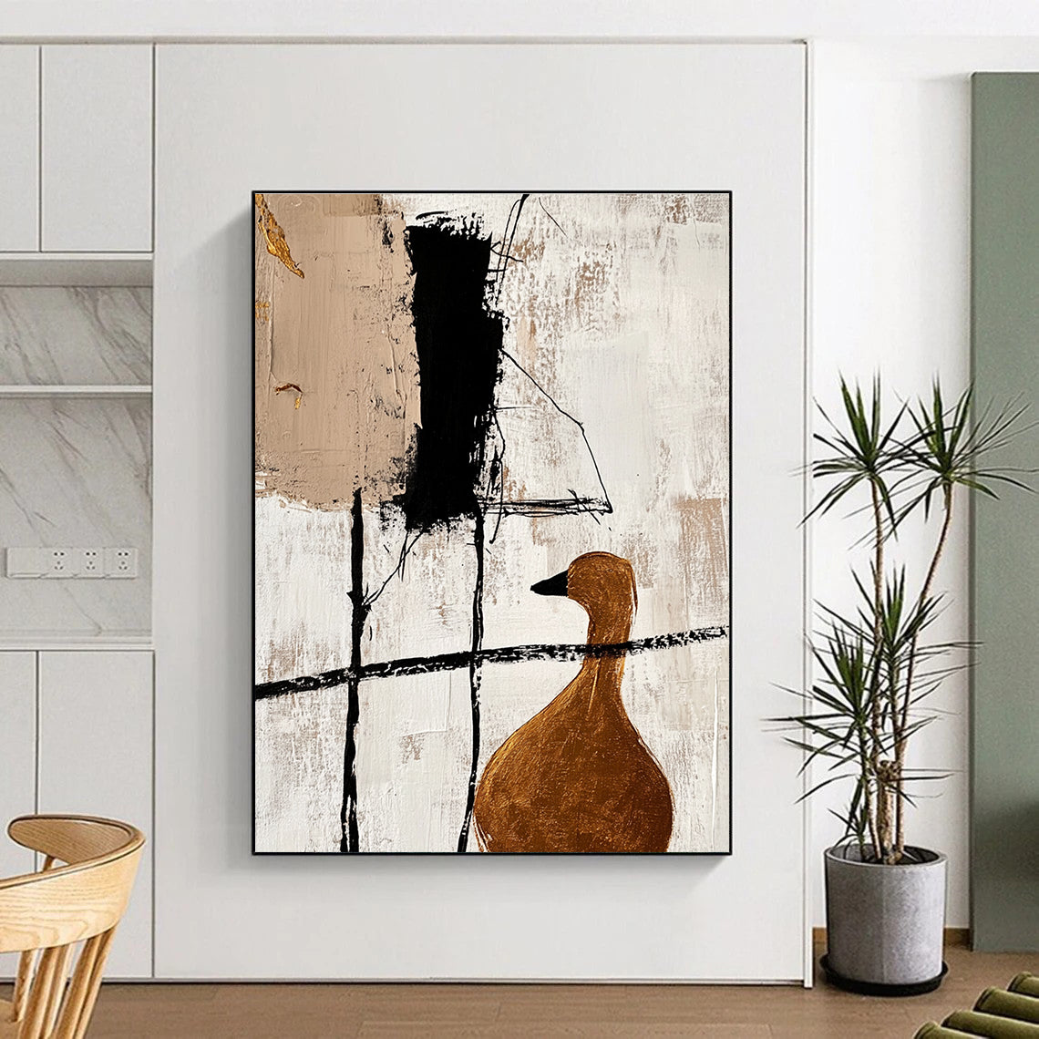 Large abstract painting featuring minimalist black lines and gold foil accents with a close-up of a golden goose in a beige color scheme.STSC466
