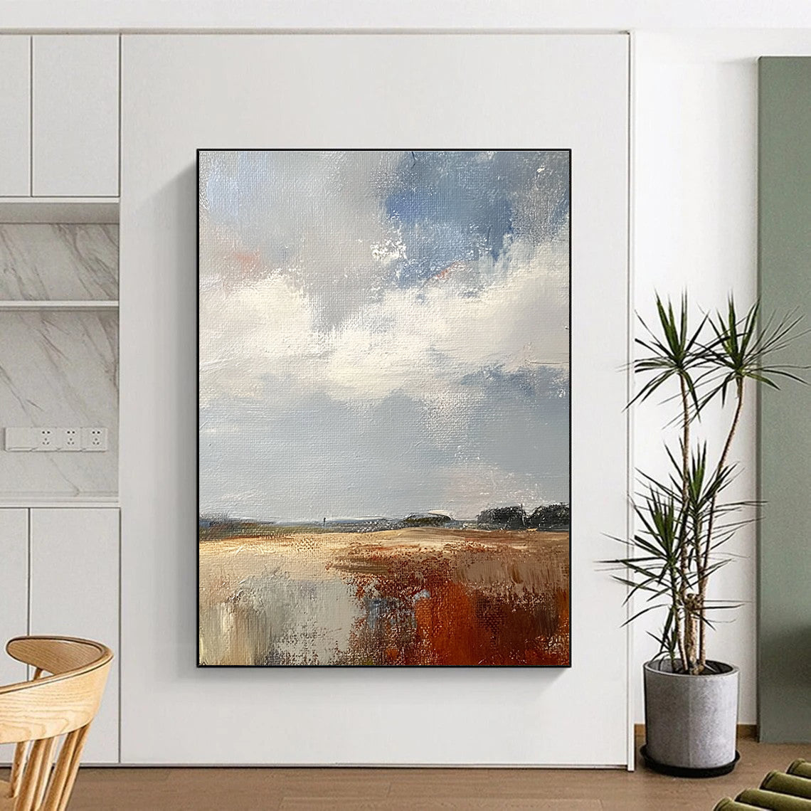 Large abstract painting featuring a white sky grey and brown clouds over the English countryside in muted colors and textured brushwork.STSC172