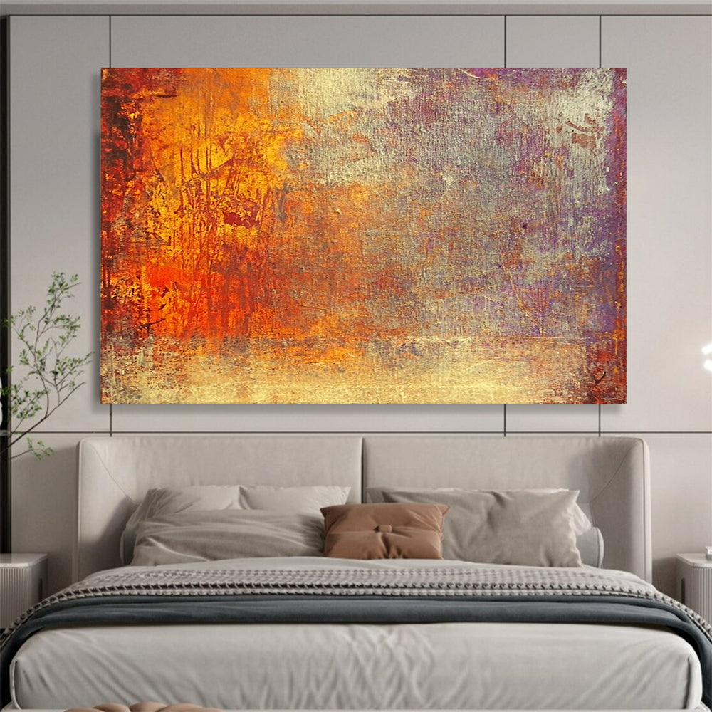 A large abstract painting featuring warm tones of gold reds and oranges evokes autumn's energy and symbolizes life's transitions with a golden sunset backdrop.SC432