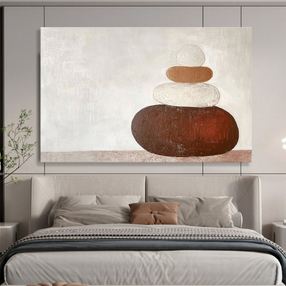 Large abstract painting in earth tones featuring three stacked rocks against a white background creating an elegant contrast.SC495