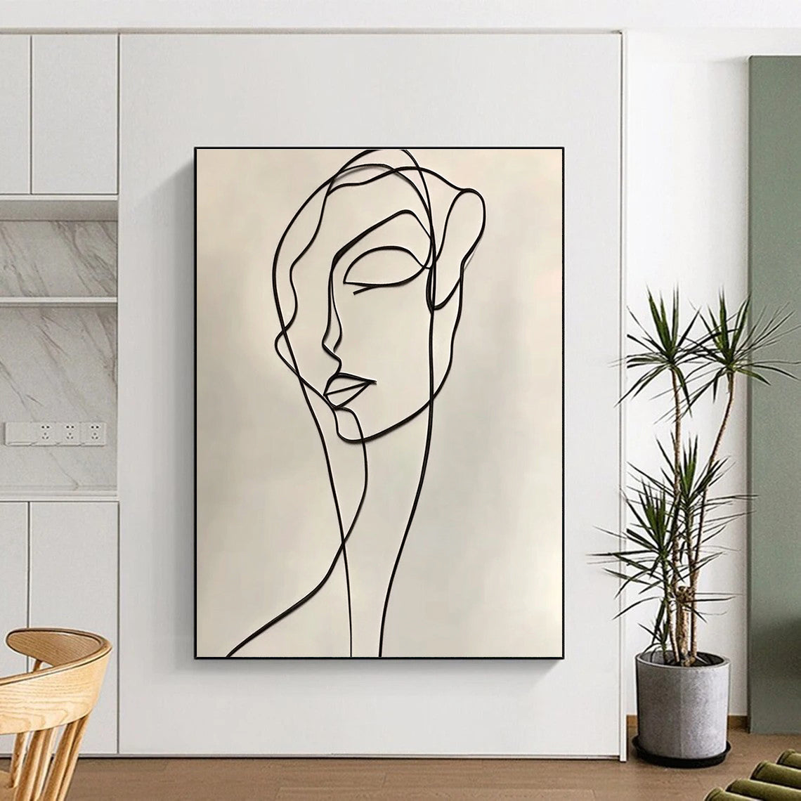 A large abstract drawing featuring a continuous line contour of a woman in elegant black ink on a white background, inspired by Henri Matisse.STSC1190
