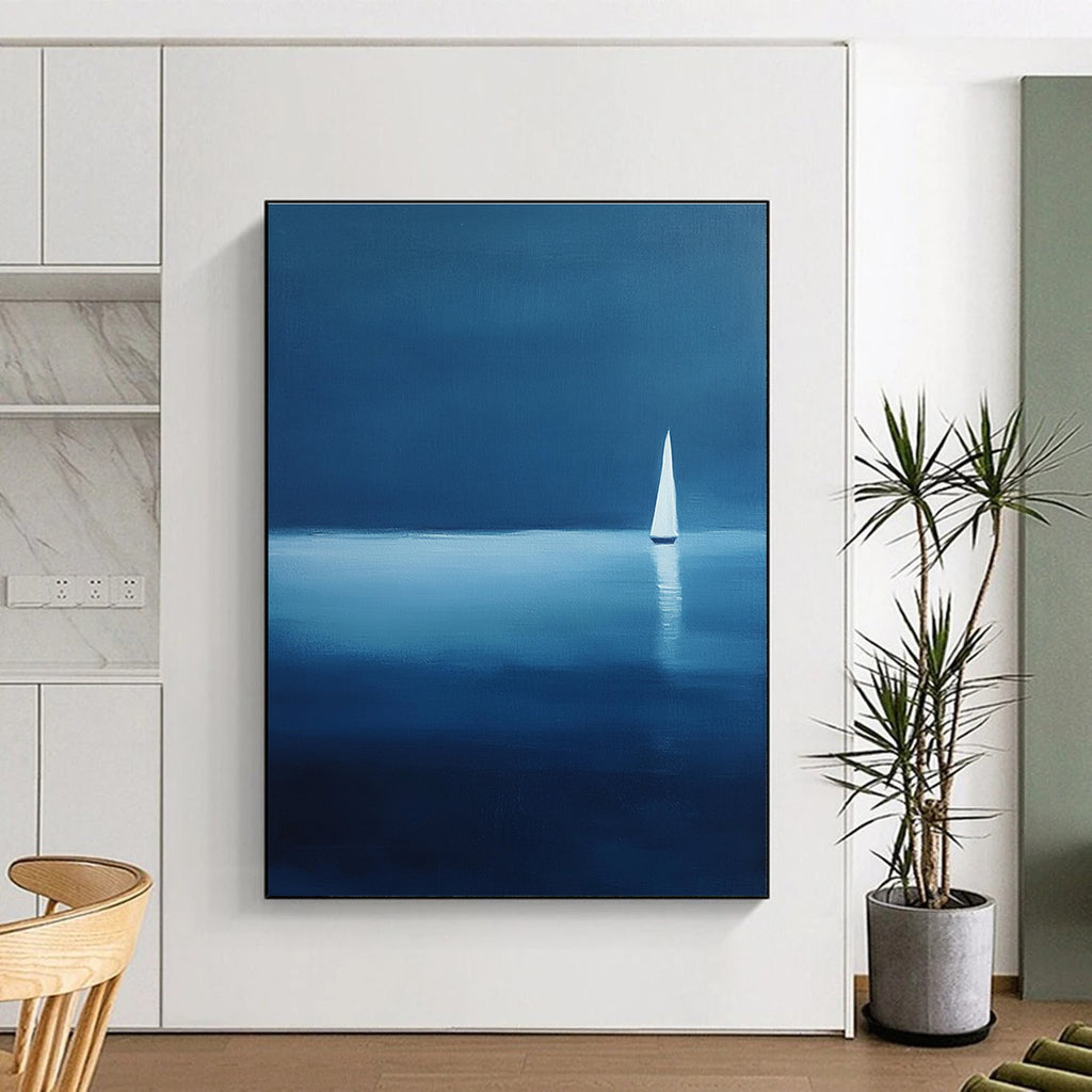 Large abstract painting of a serene sailboat on calm waters using blue and white shades against a dark backdrop evoking tranquility and solitude.STSC1086