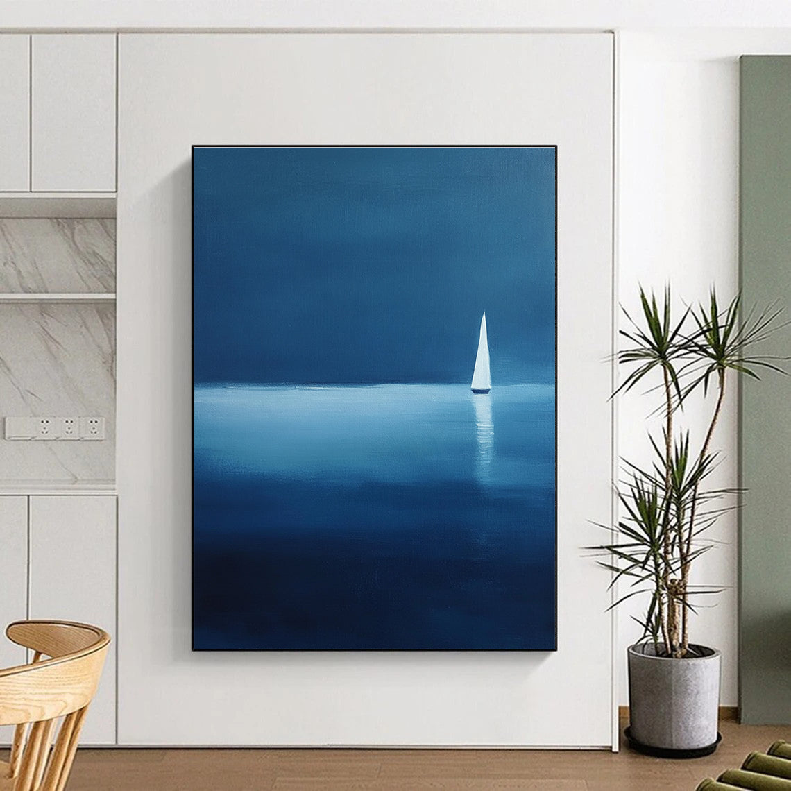 Large abstract painting of a serene sailboat on calm waters using blue and white shades against a dark backdrop evoking tranquility and solitude.STSC1086