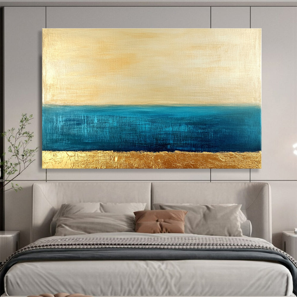 Large abstract painting featuring a golden sky and blue sea with textured gold accents and a soft minimalist aesthetic.SC172