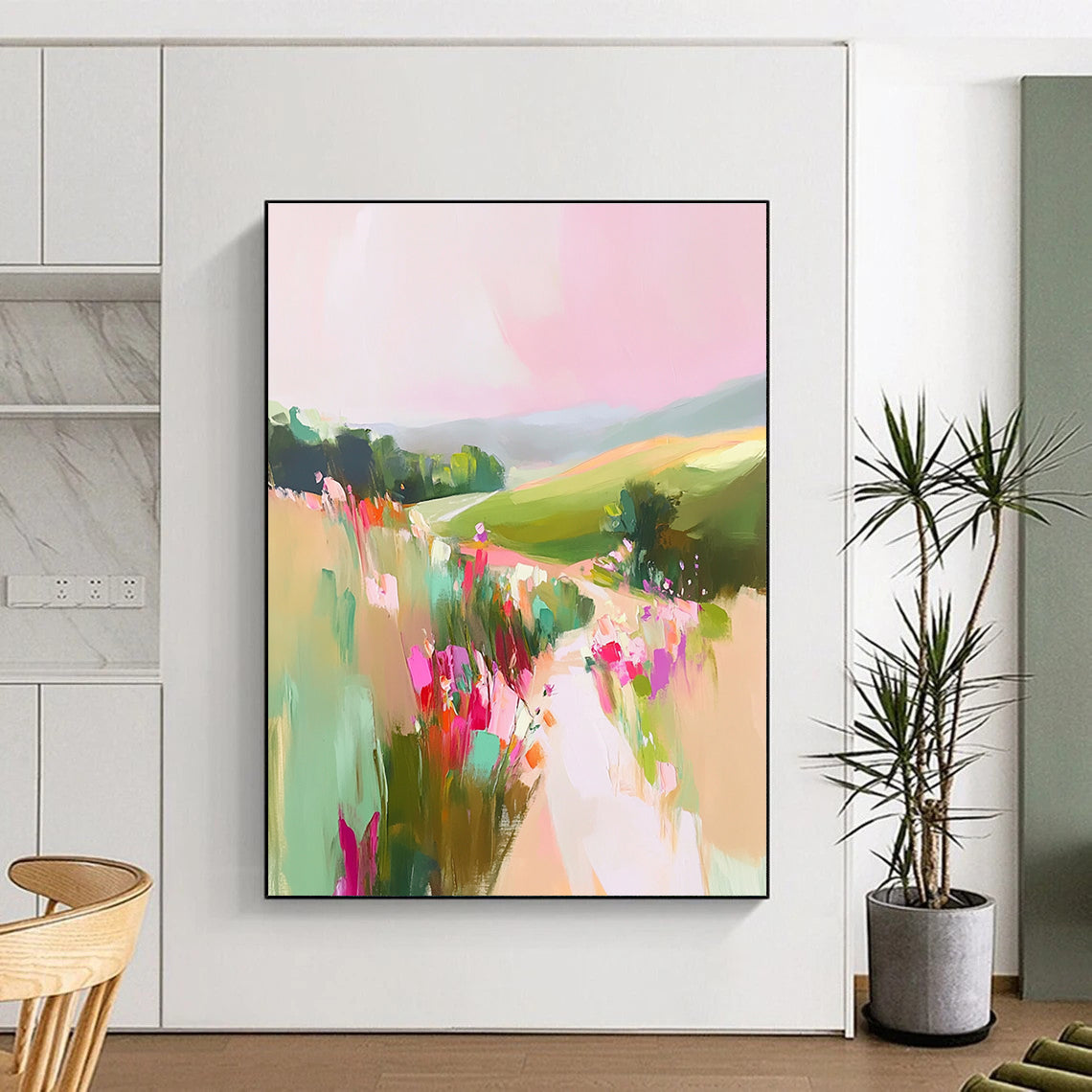 A large abstract painting of English countryside with pastel pinks and greens featuring rolling hills and wildflowers for a romantic tranquil atmosphere.STSC1202