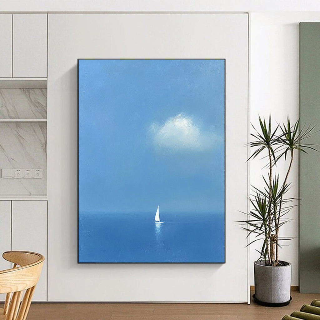 Large abstract painting featuring a white sailboat on the sea in light blue and indigo colors creating a dreamy atmosphere with ethereal clouds.STSC1255